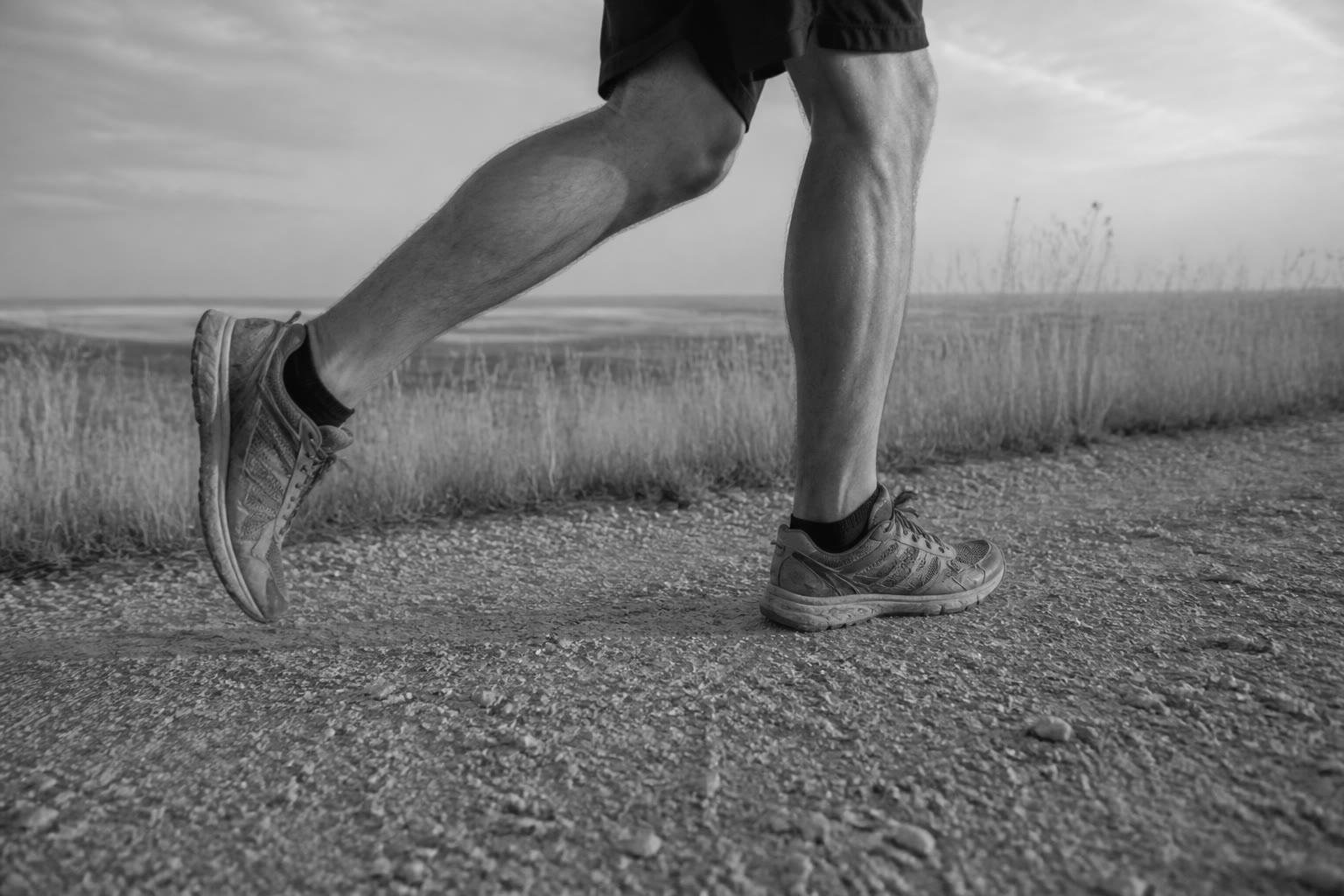 A runner moving along an open trail.